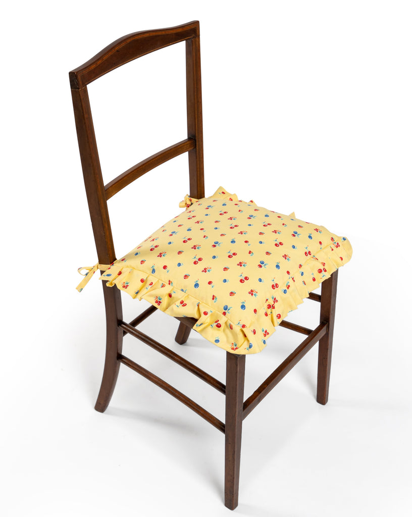 Photo Sharland-England's Edwardian occasional chair featuring delicate hand-crafted marquetry inlay, caned seating and a handmade tie-back seat cushion in a vintage cherry print fabric by Darlene Zimmerman