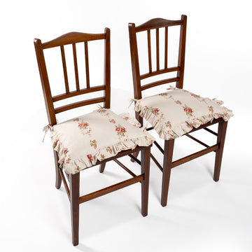 Photo of Sharland-England's pair of Edwardian occasional chairs with hand-crafted inlay, caned seating and matching handmade tie-back seating cushions, in a 1980’s vintage chintz Laura Ashley fabric
