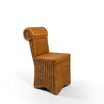 Photo of Sharland-England's Letty slipper chair, hand-crafted from 100% natural rattan and featuring undulating lines and feminine silhouette
